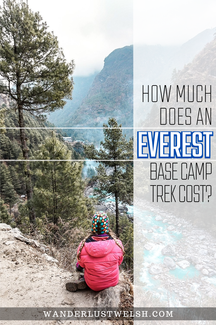 A girl sitting on a rocky outcrop overlooking the enormous Khumbu valley and river on the trek to Everest Base Camp