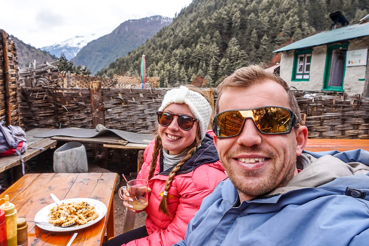 A couple eating noodles at a restaurant in the Himalayan mountains