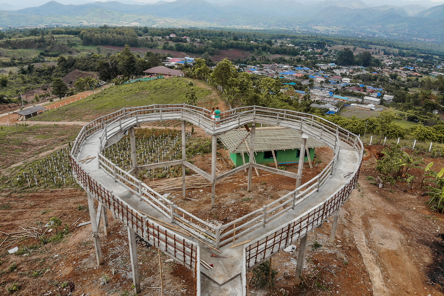A couple stood on a large, heart-shaped, metal walkway