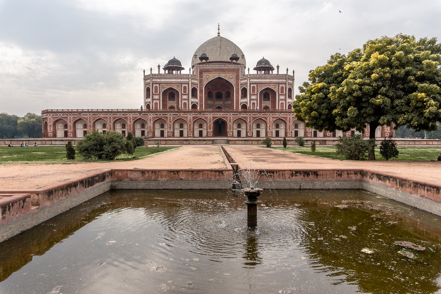 Red Mughal tomb with a large water feature