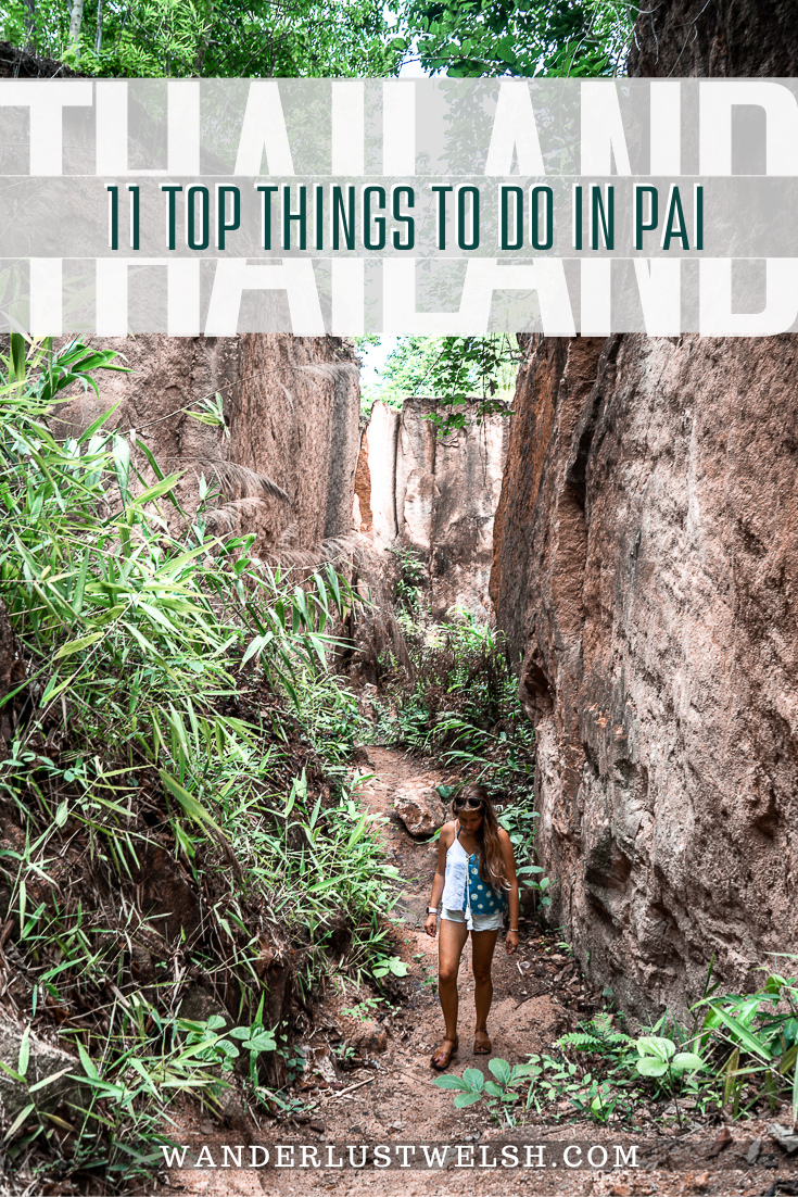 A girl walking between a land split canyon
