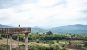 A panoramic view of the Thai countryside with a girl overlooking from a walkway