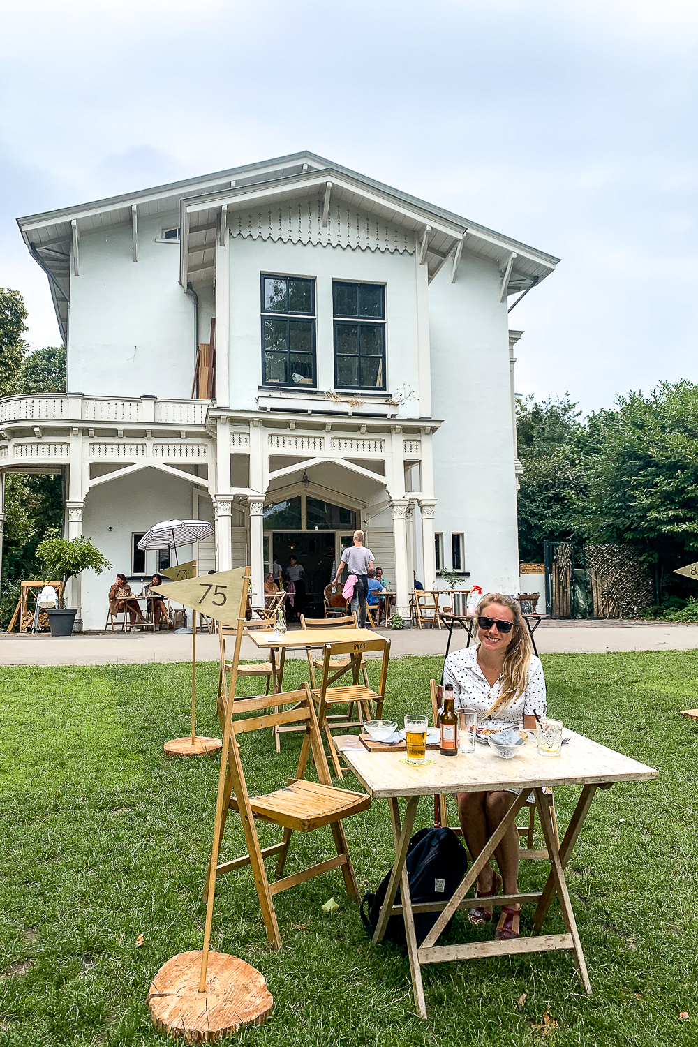 A girl enjoying lunch outside a cute park cafe
