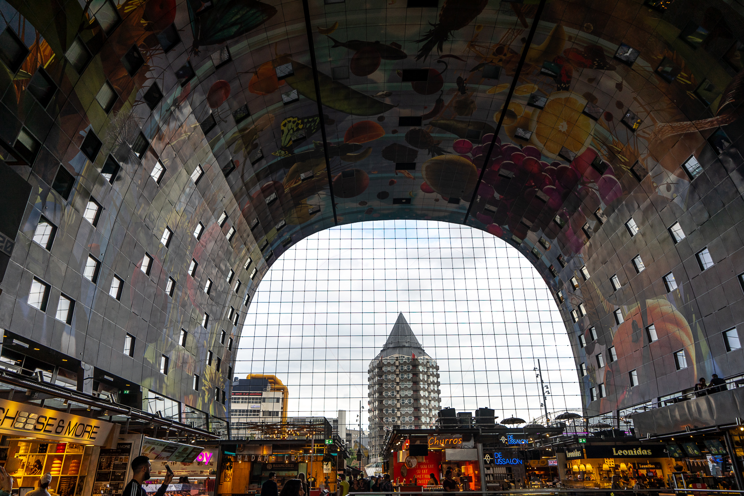 Panoramic of the Market hall in Rotterdam - A gigantic, rounded ceiling with street art covering the whole surface