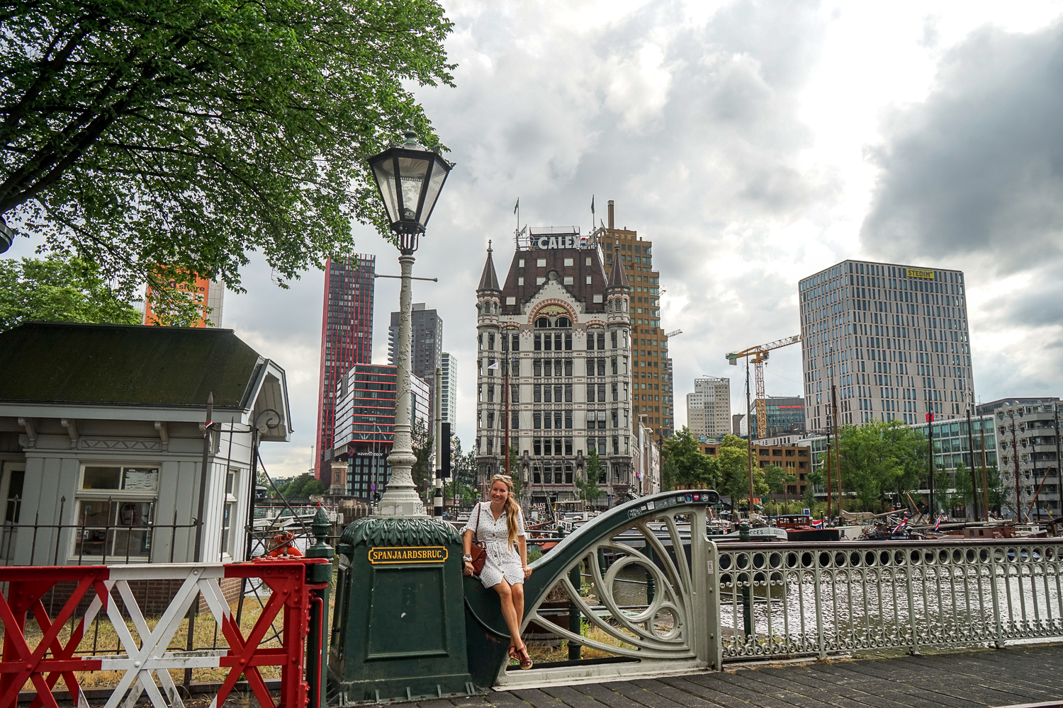 Girl sitting in the old harbour in Rotterdam