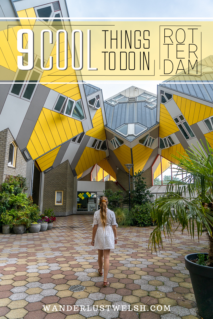 Girl walking through the yellow cube houses in Rotterdam