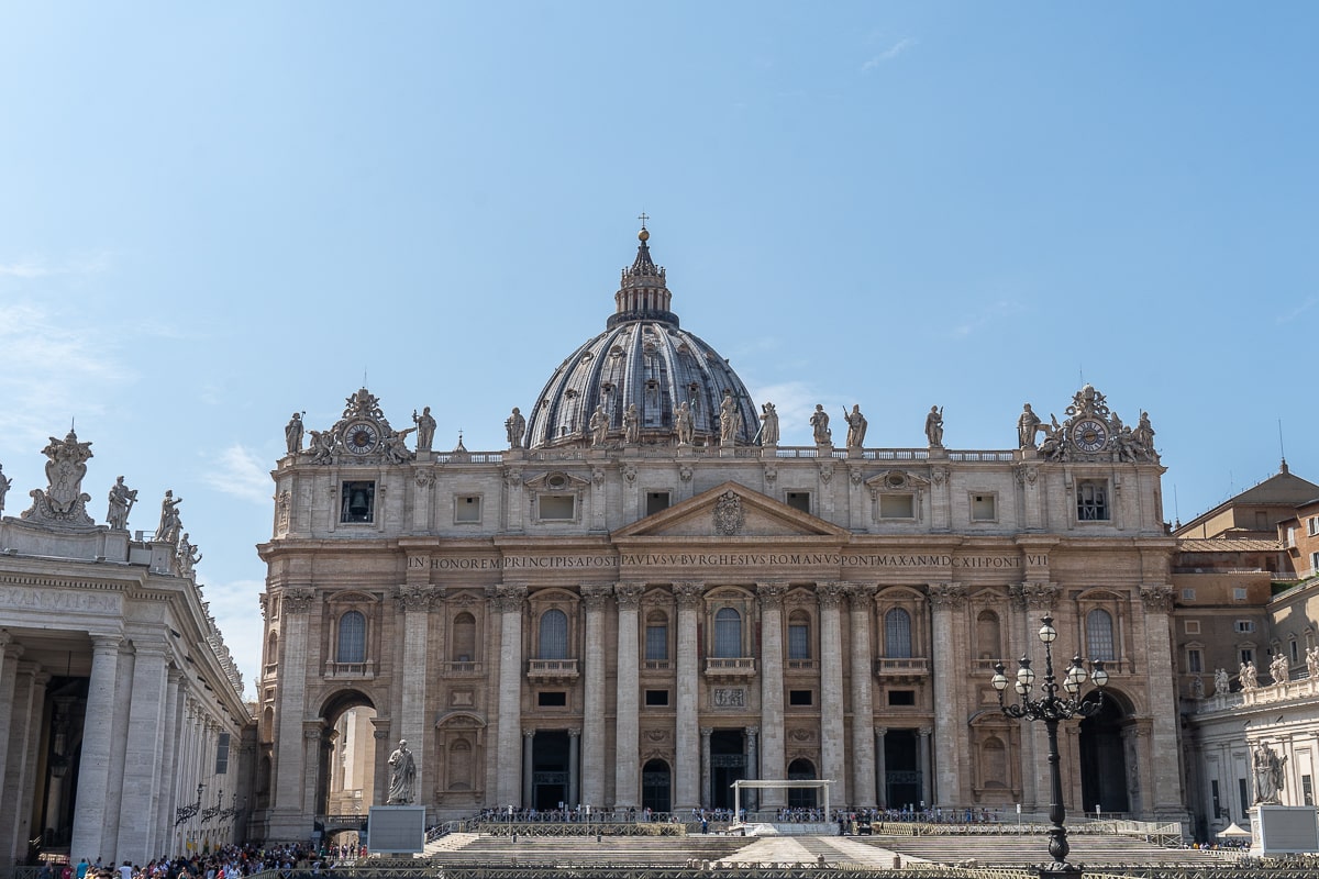 St. Peters square in The Vatican City, a stunning city adorned with magnificent buildings and the basilica.