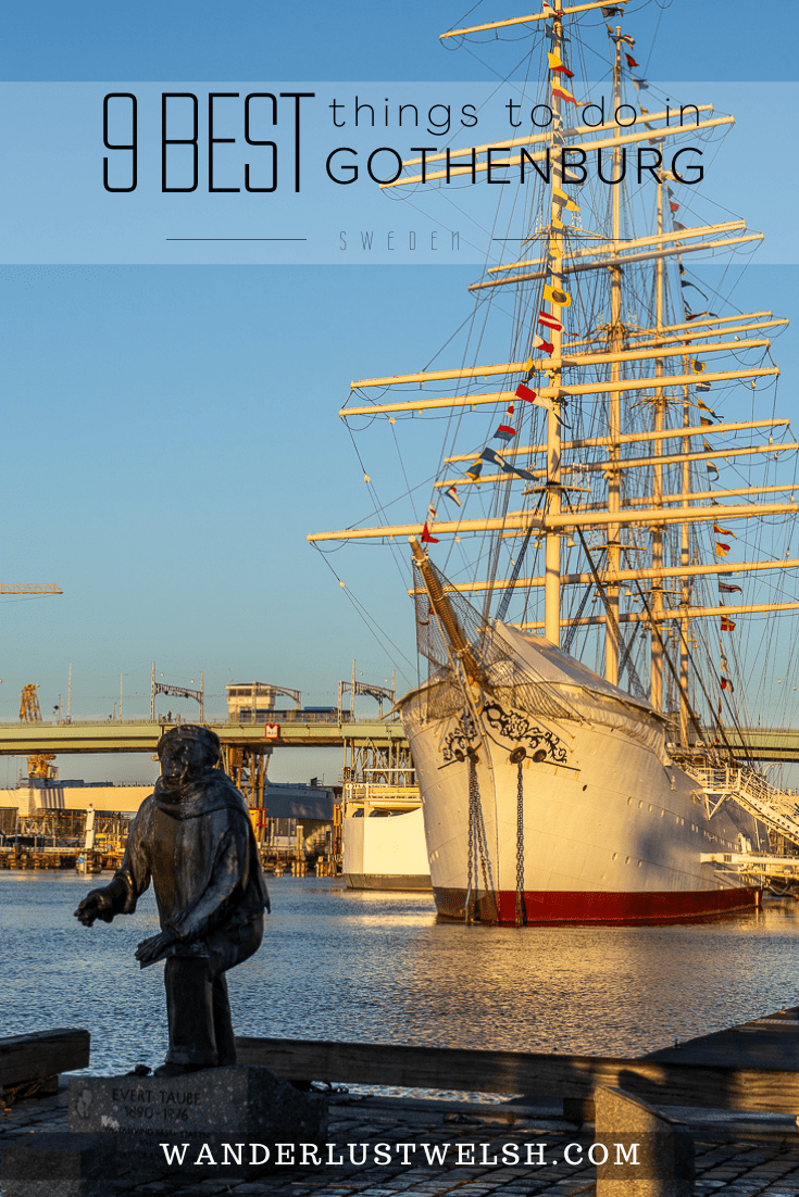 A huge sailing ship docked in Gothenburg with a fisherman statue in the foreground