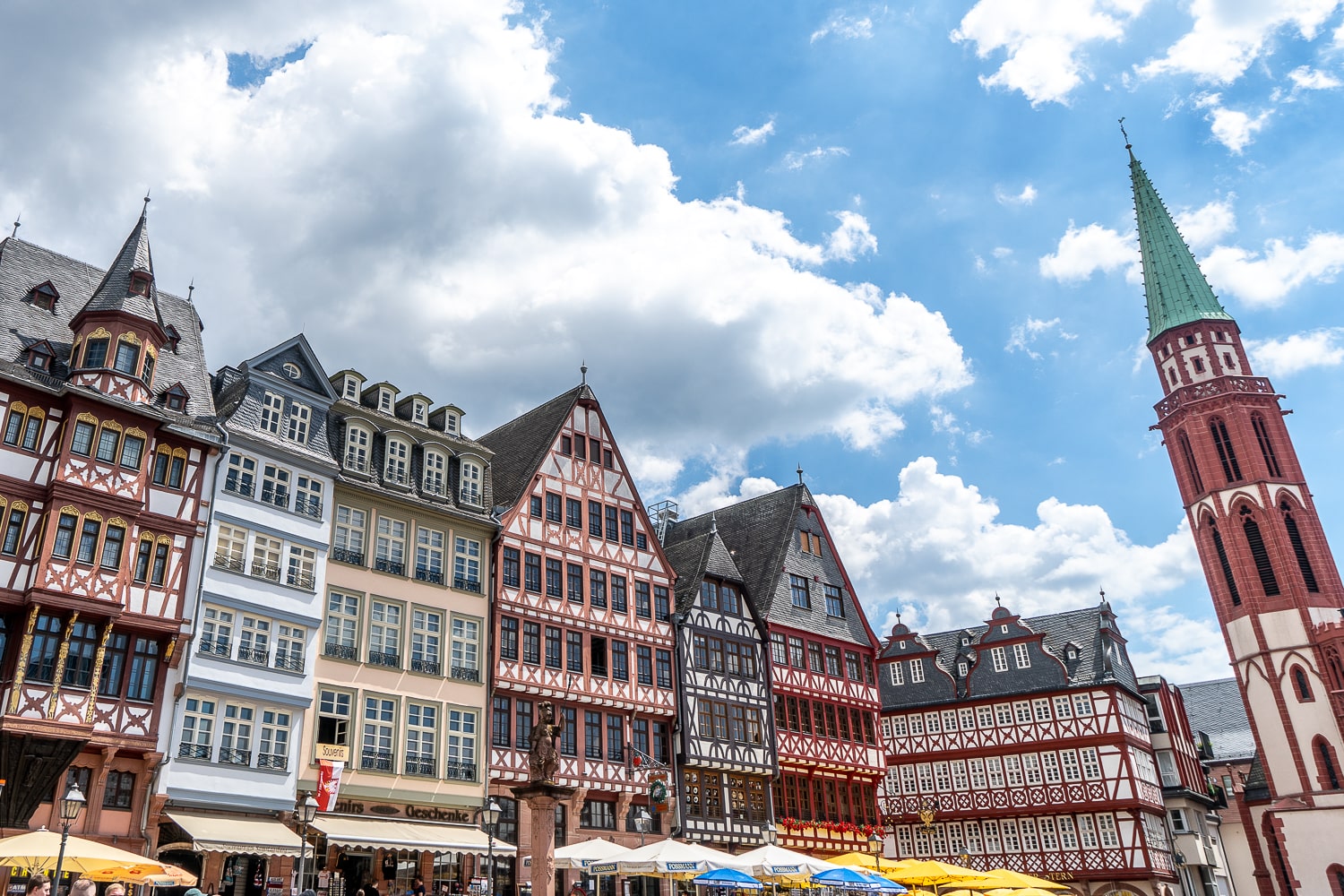 A beautiful old town with late gothic style buildings made with wooden beams and colourful paint and patterns