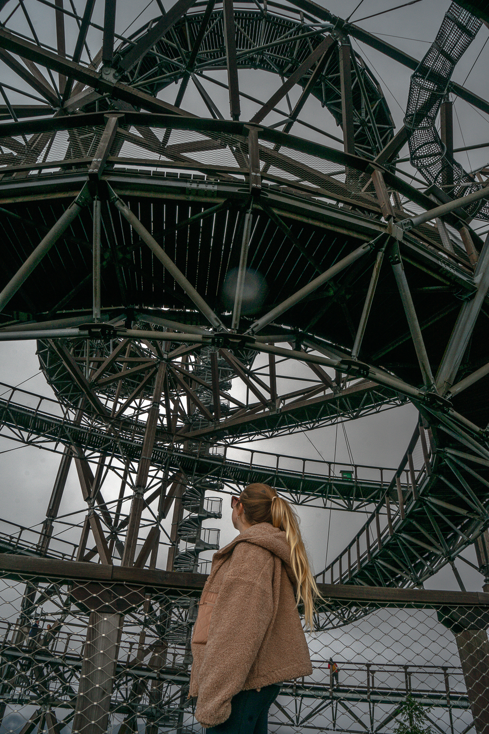 A girl looking up at the Sky walk in Dolni Morava