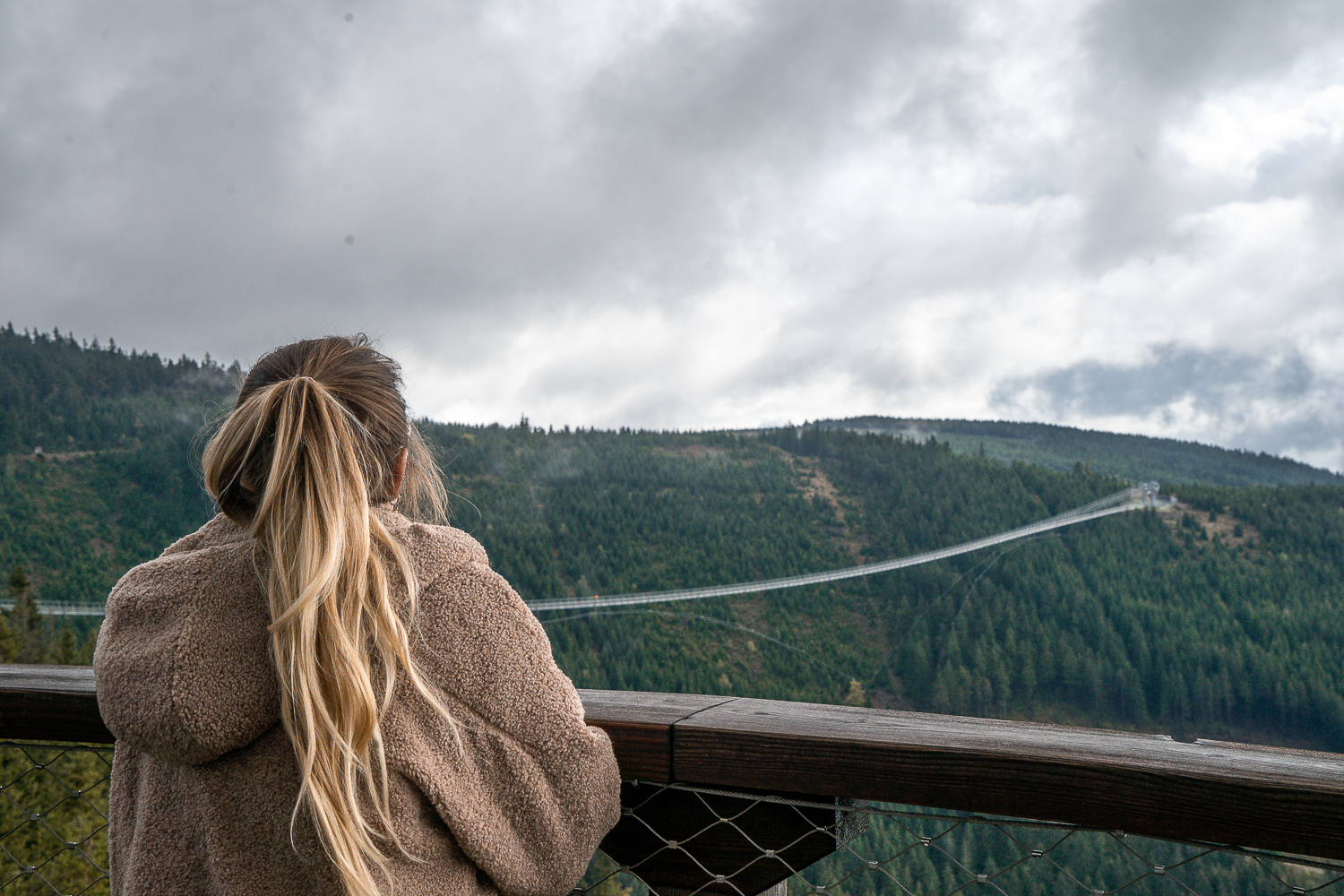 Girl looking at Skybridge721 in the distance