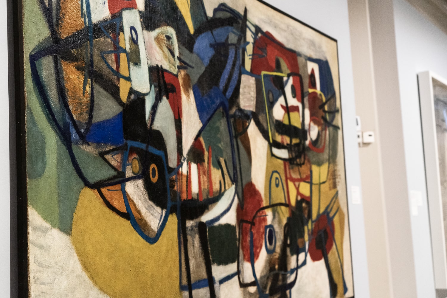 Colourful abstract artwork with surrealist faces