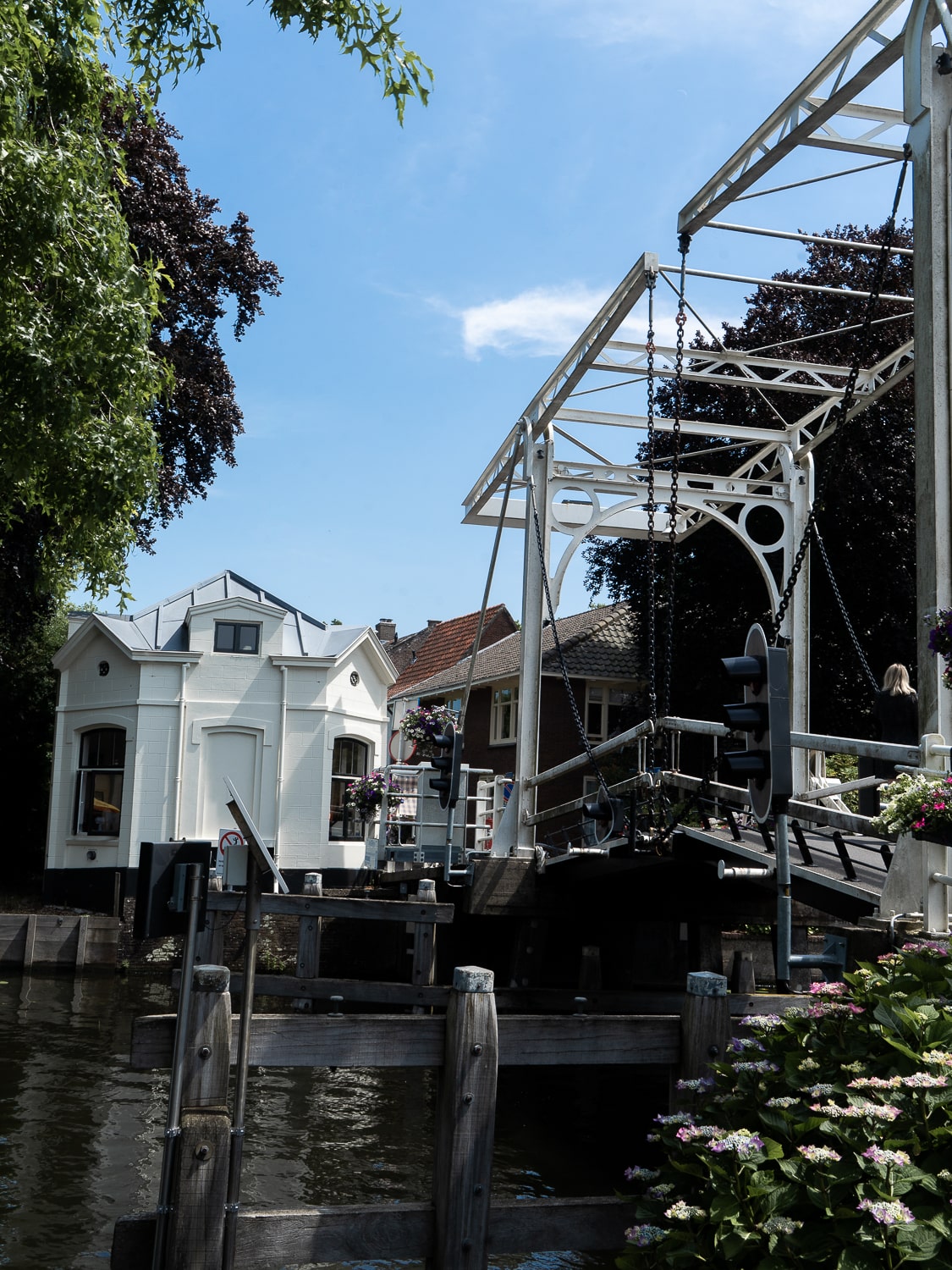 A white Dutch style drawbridge over the river Vecht