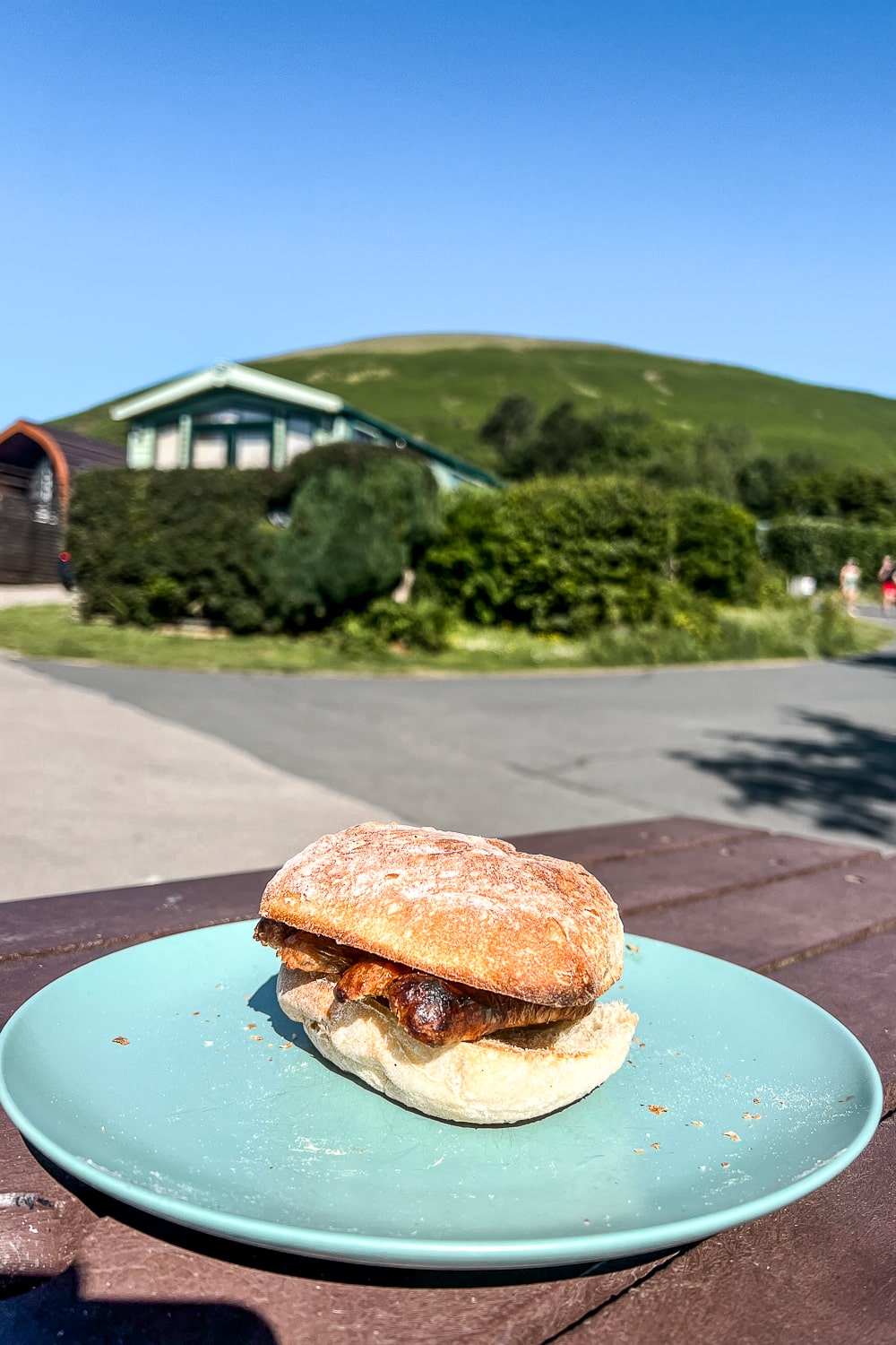 a bacon roll on a plate