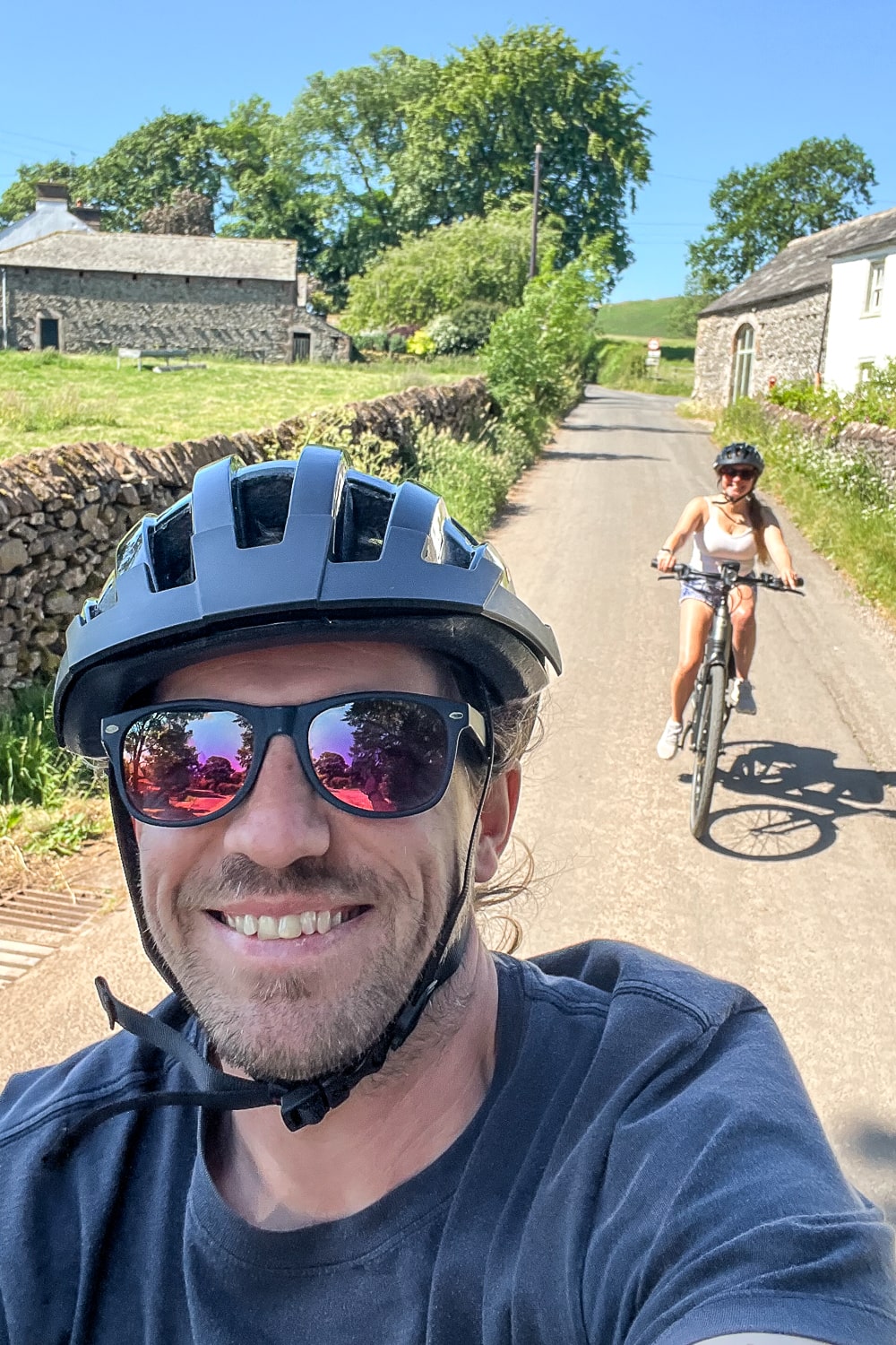 a selfie of a couple riding bikes