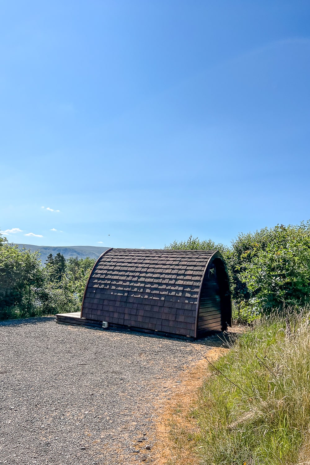 a rounded roof wooden glamping pod
