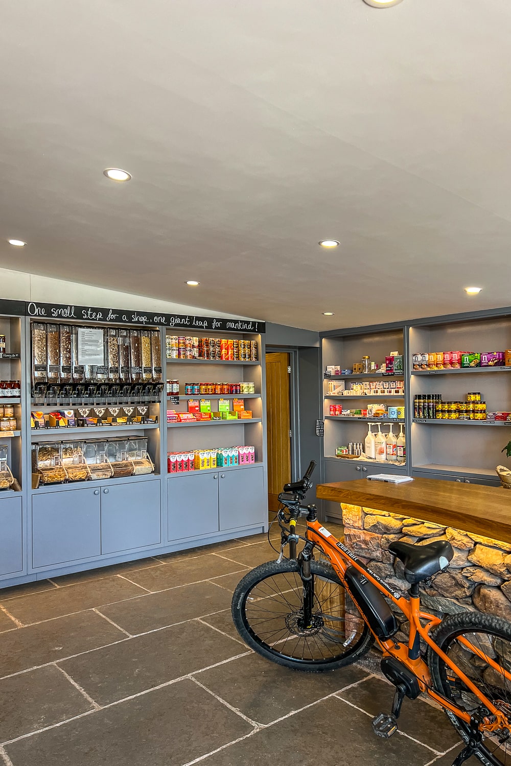 a shop with dispensers for cereal, nuts, and dried goods