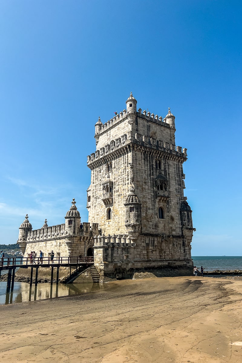 A stone tower on a beach