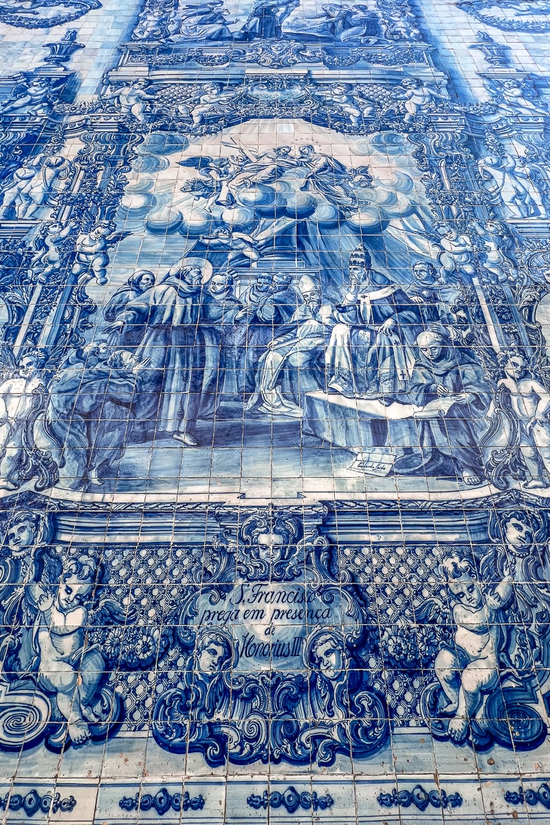 A scene of St. Francis in blue and white azulejo tiles