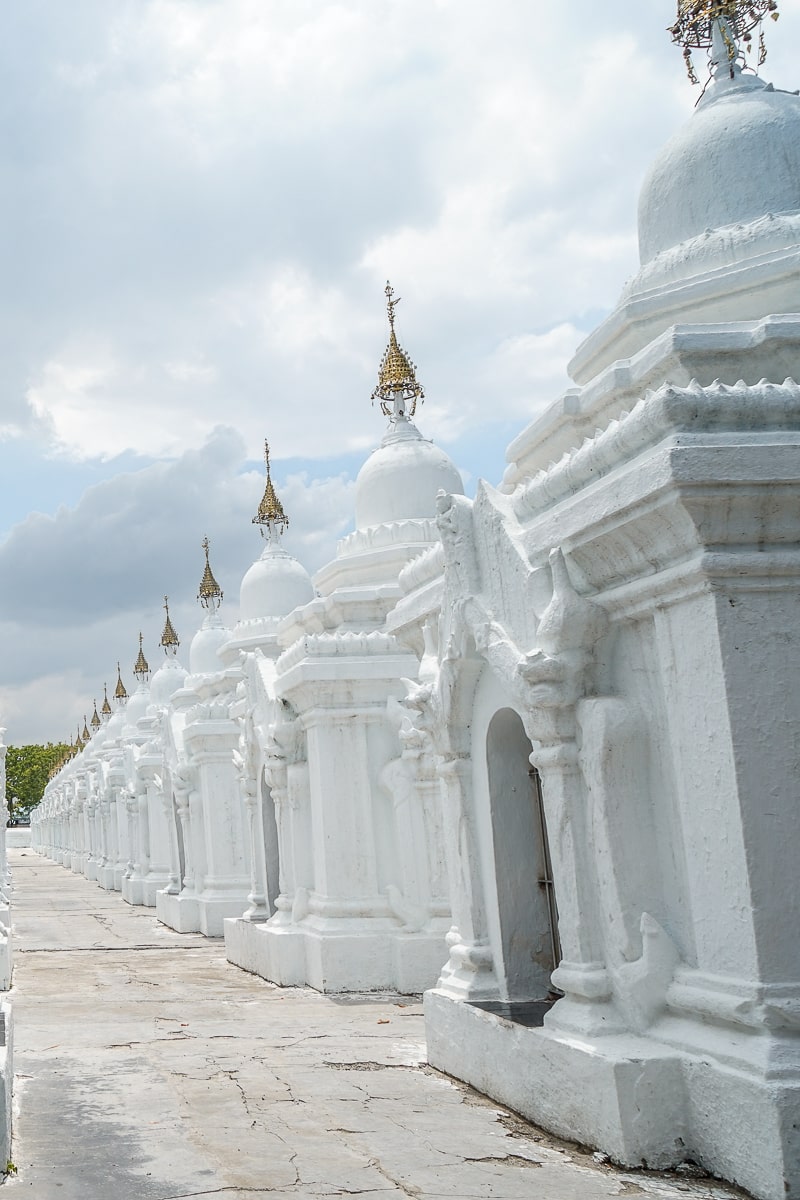 A series of small, detailed white buildings with small doorways