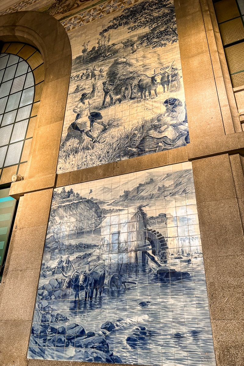 A blue and white azulejo tiles depicting farming scenes with oxen