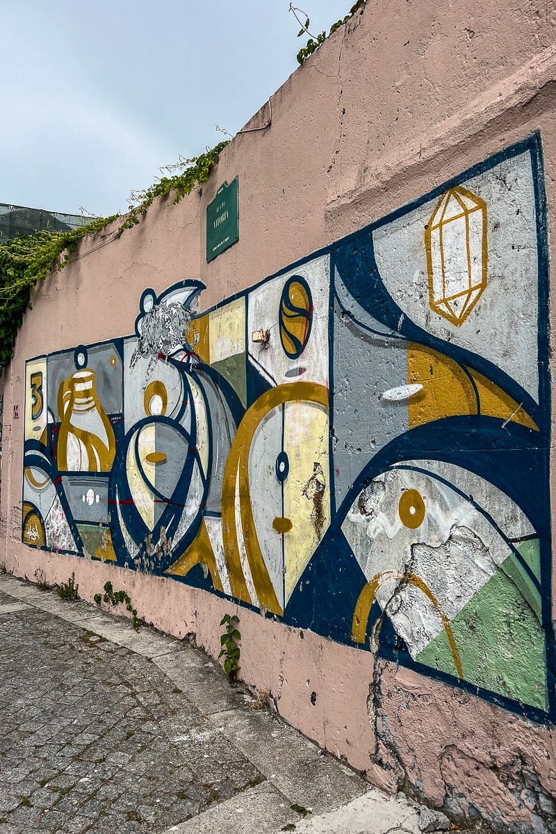 A colorful street art piece with waves and curls