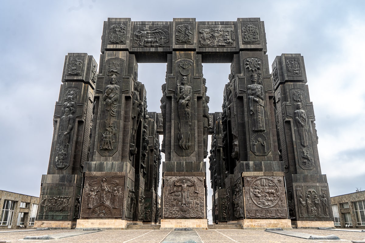 The Chronicle of Georgia - a large structure made of stone columns with engravings of Georgia's history