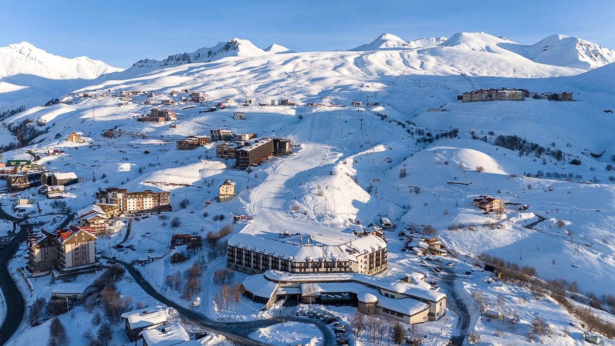 An aerial shot of Gudauri and its ski slopes covered in snow