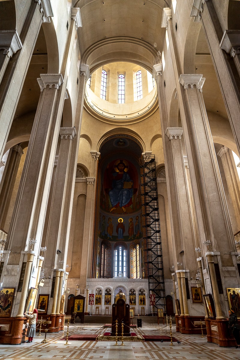 Inside a tall cathedral with vaulted and domed ceilings