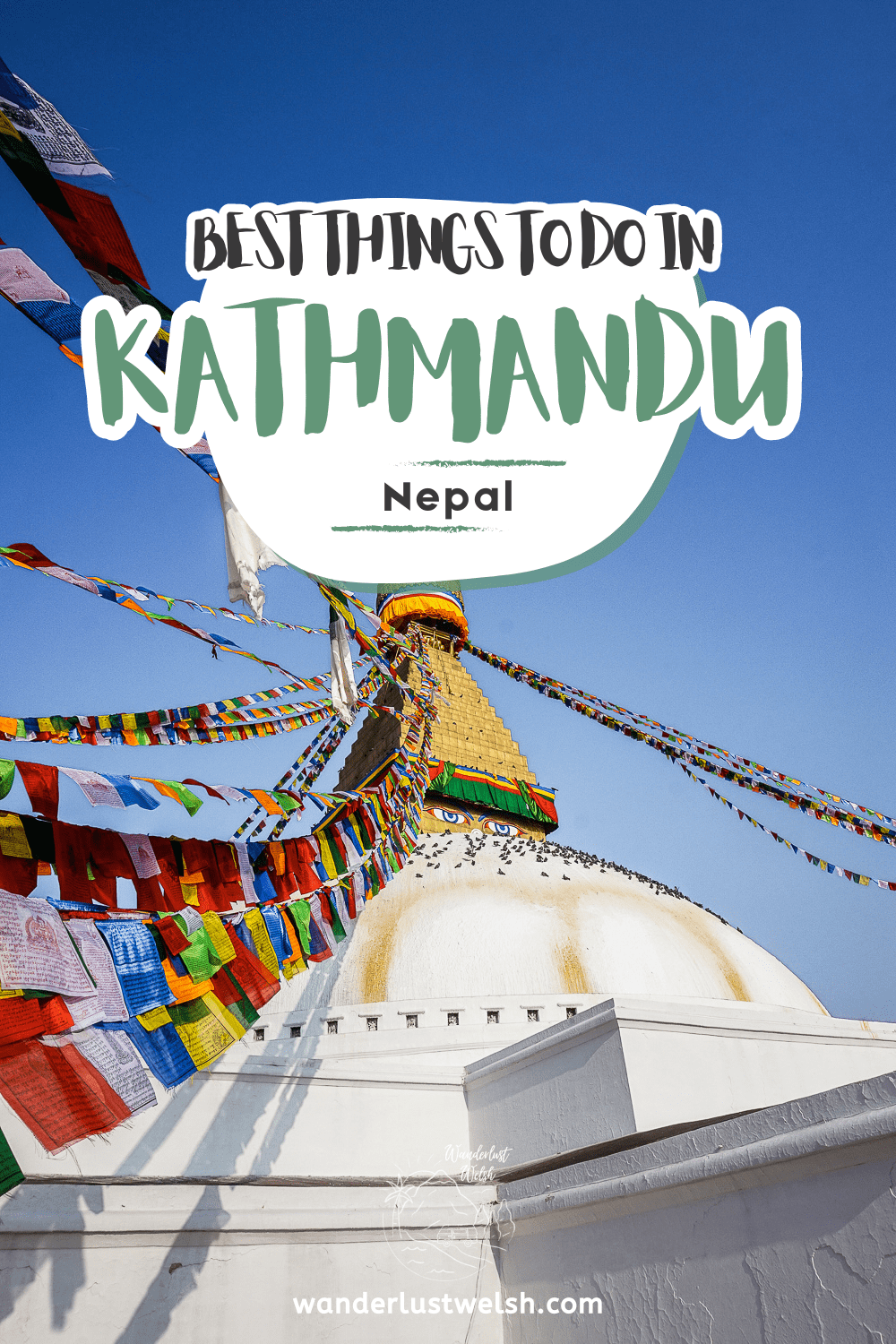 Prayer flags streaming from the top of a white and gold stupa with the words "Best Things to Do in Kathmandu" superimposed