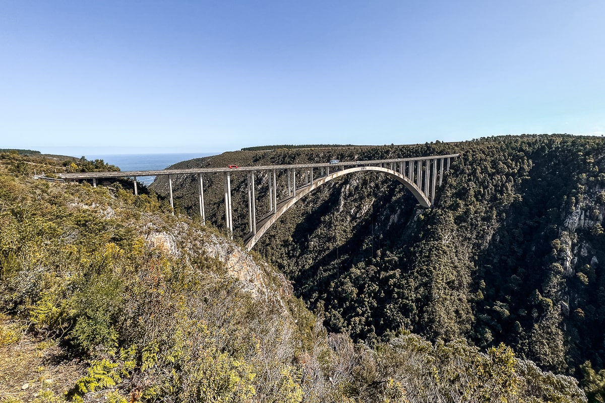 A large arched bridge spanning a huge valley