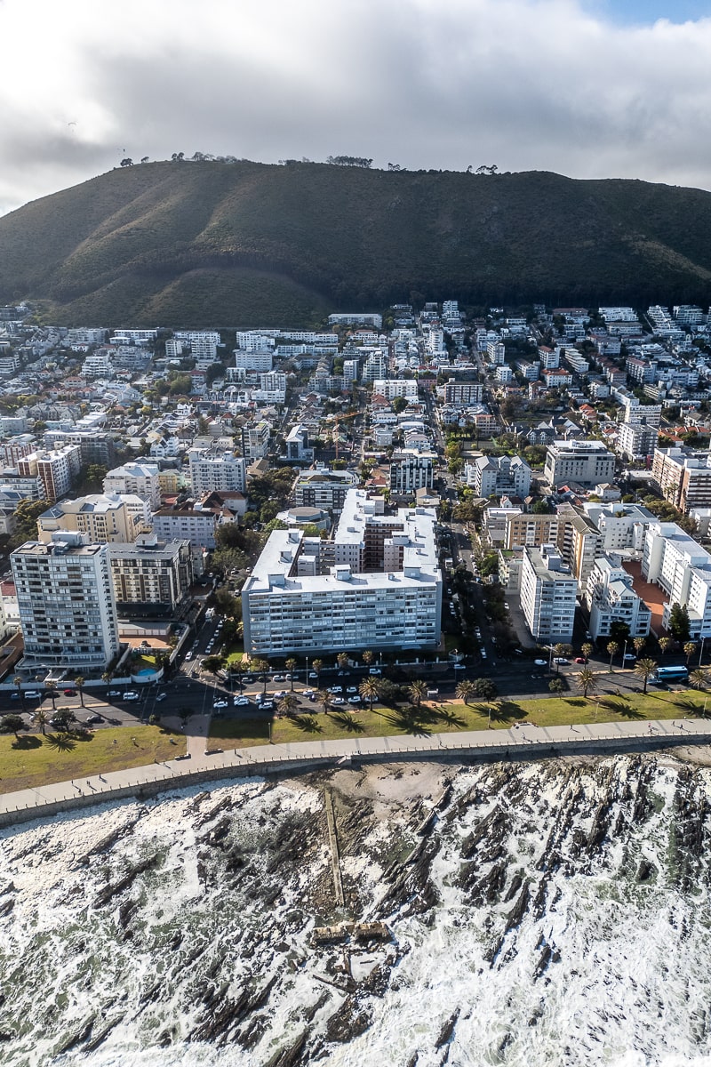 An aerial shot of Table Mountain and buildings in Cape Town