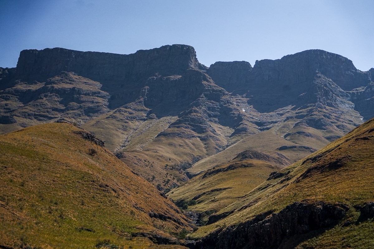 A view of dark Drakensberg mountains with a straight plateau