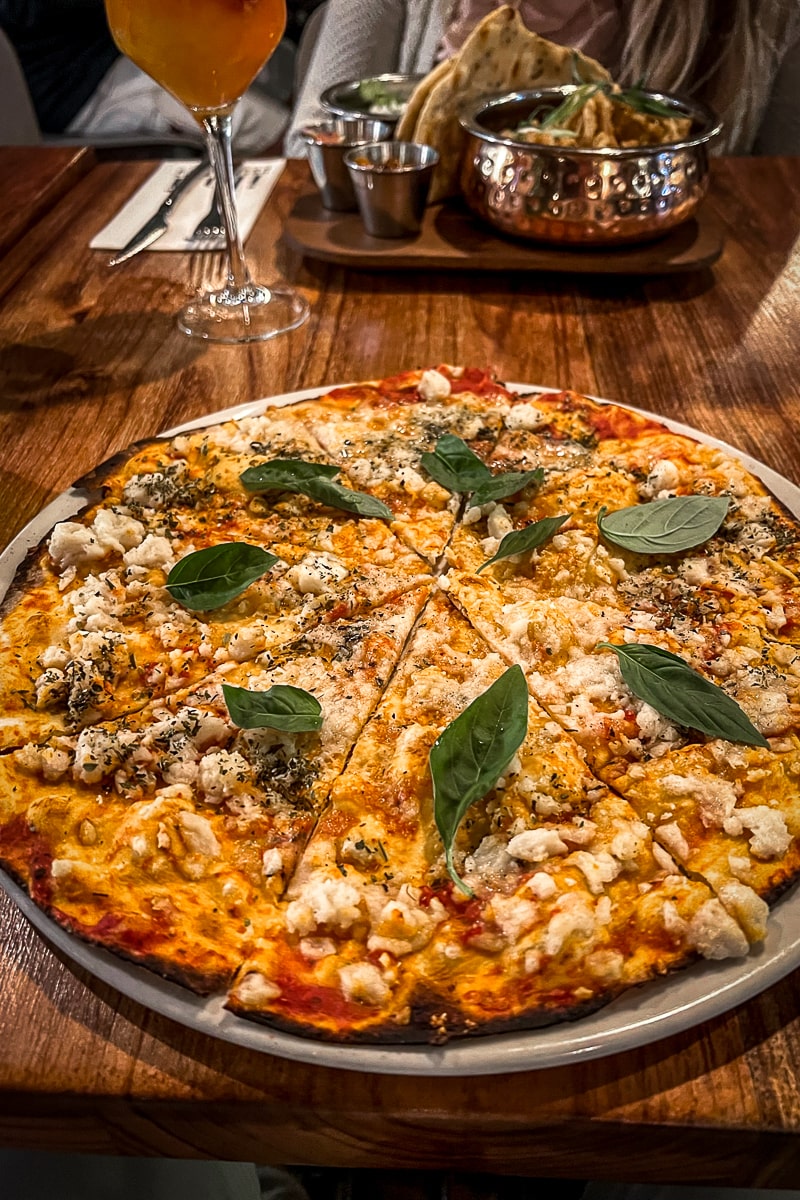 A pizza with basil