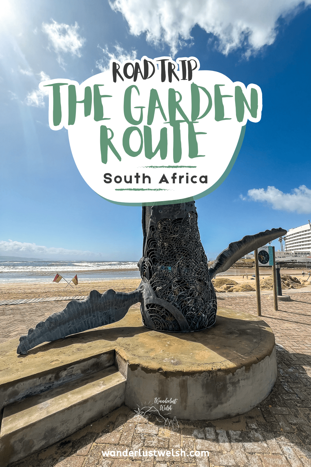 A whale statue at the beach with the words "Road Trip The Garden Route" superimposed