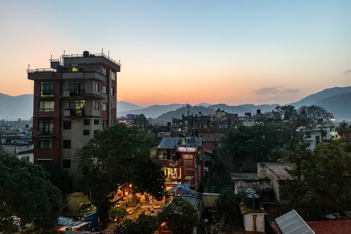 A sunset over Kathmandu and the surrounding mountains from a rooftop