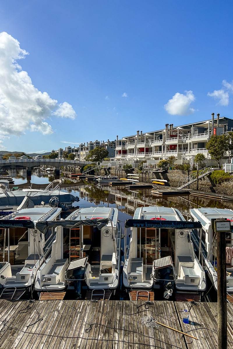A row of boats docked in a marina