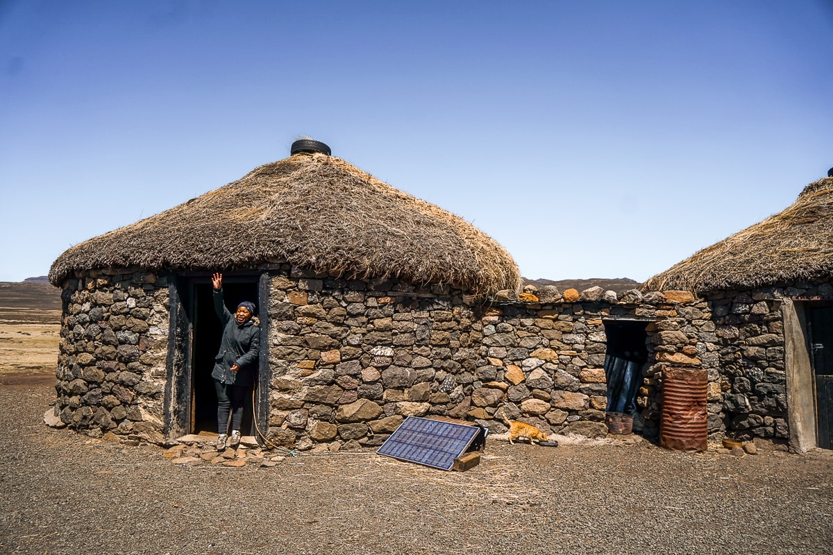 A traditional Lesotho hut made from dry stone walls and thatched roof