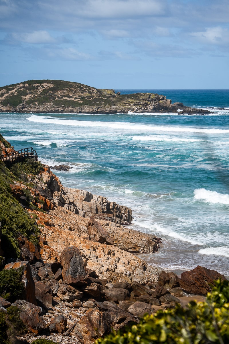 A rocky shoreline and big waves