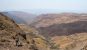 A woman enjoying the viewpoint of the rocky Sani Pass