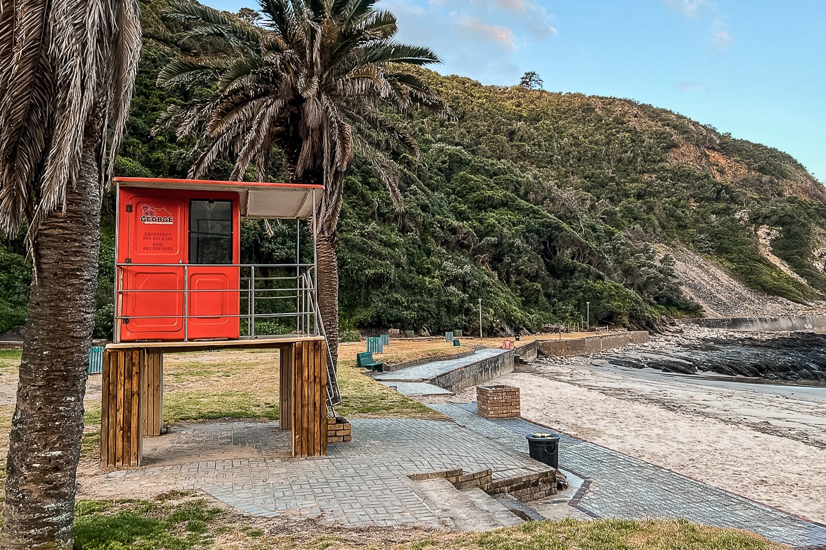 An orange lifeguard station at the beach