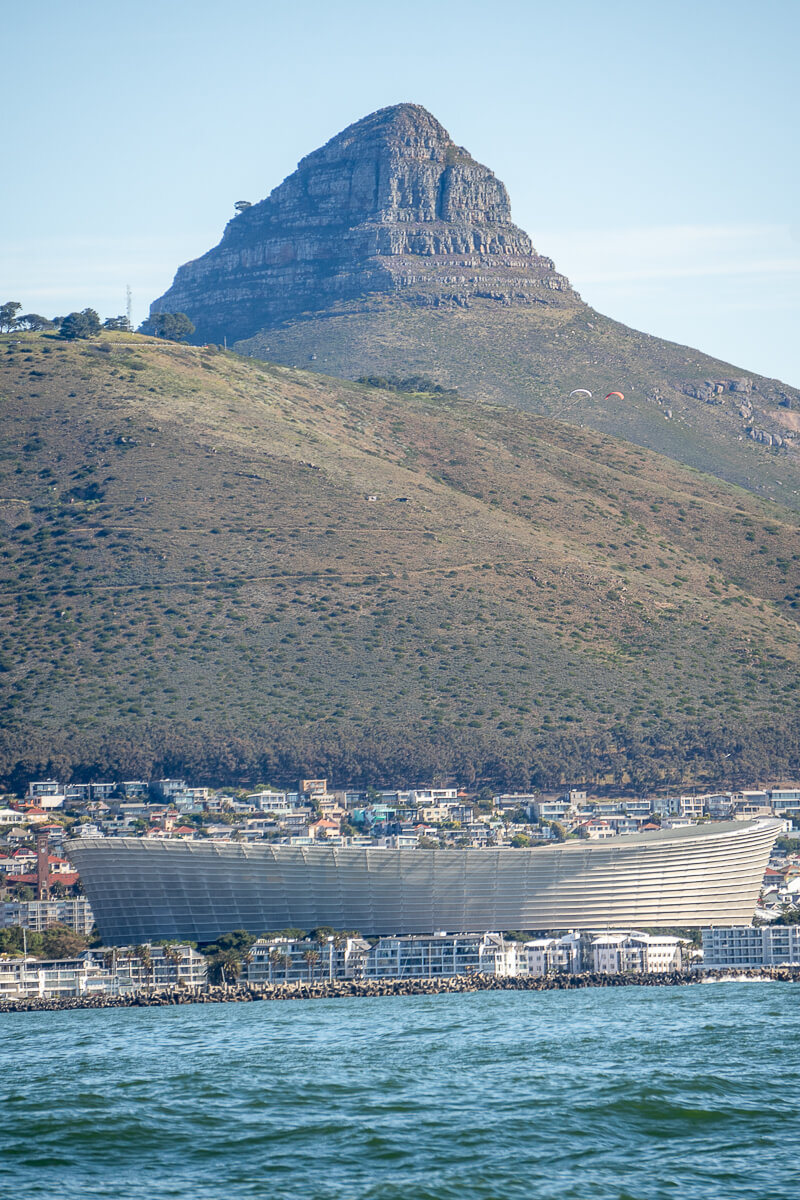 A large stadium in Cape Town with Lion's Head Mountain behind