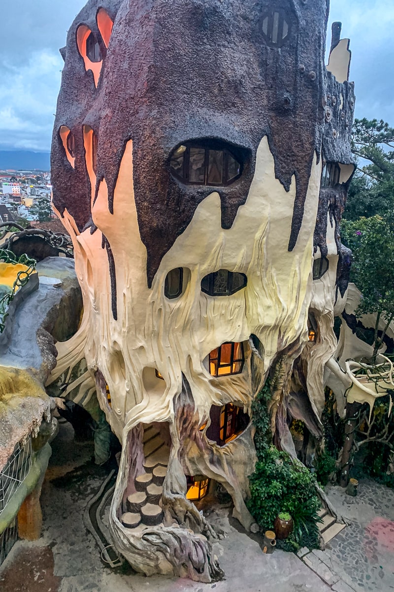 A strange cave-like strucure with windows looking into rooms