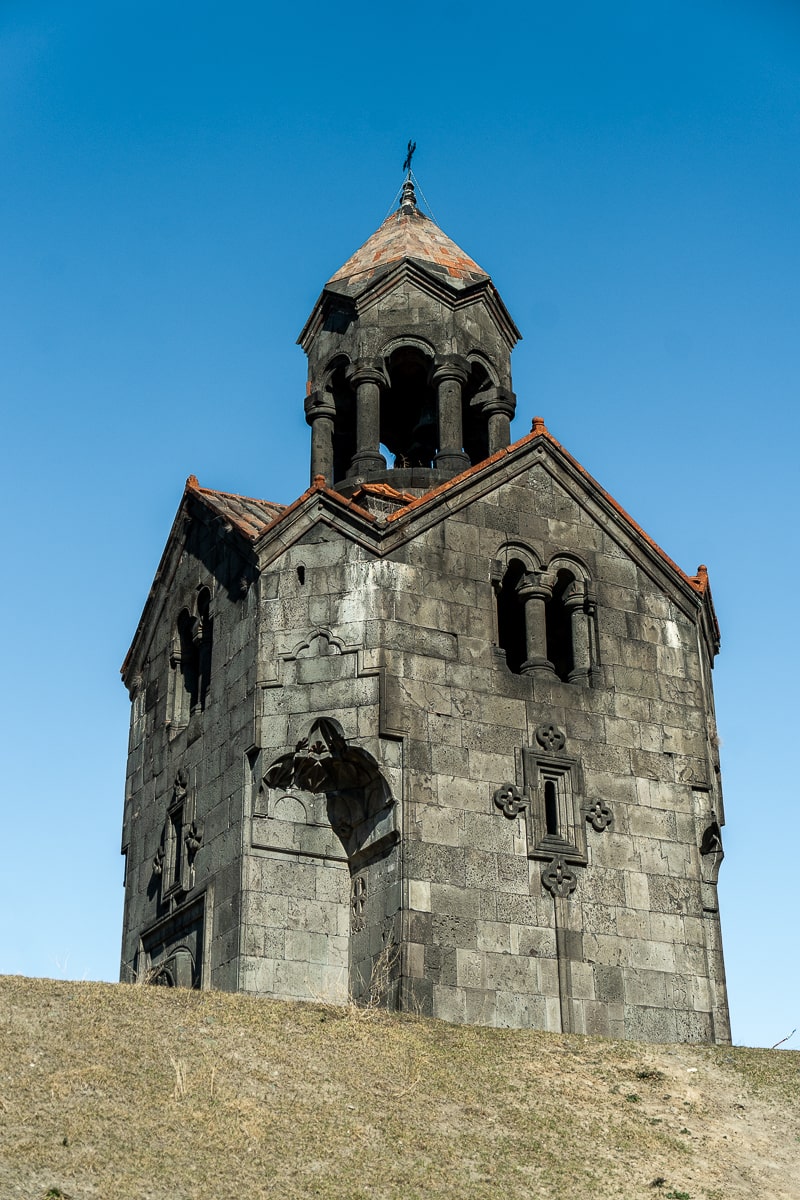 A grey stone bell tower