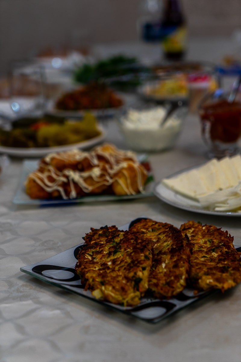 Traditional Armenian food like breads and potatoes laid out on a table