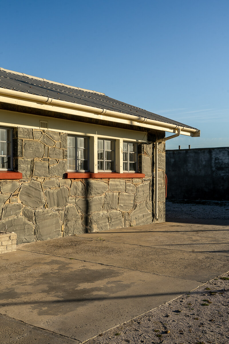 A grey stone prison block