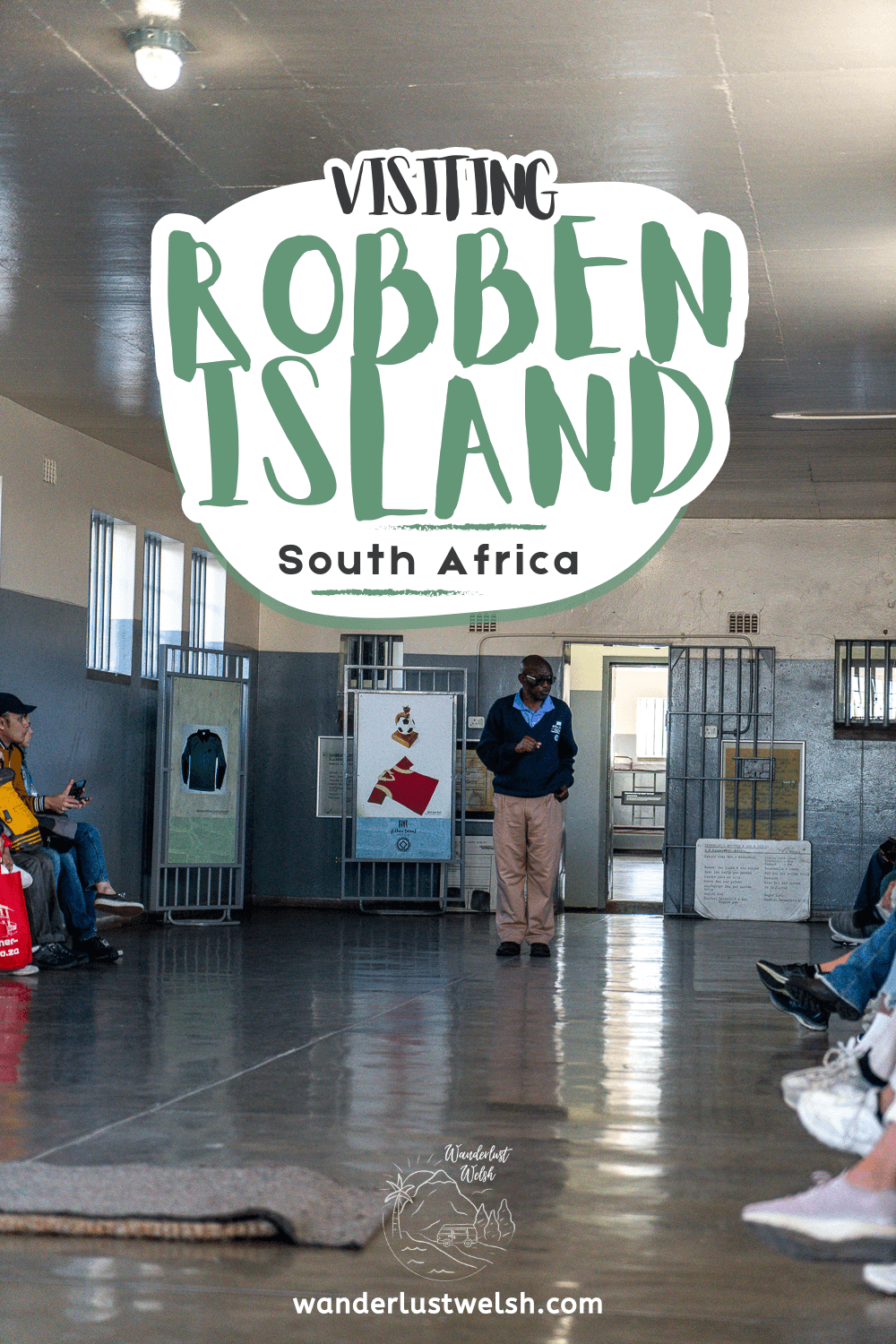 A guide giving a talk in a communal prison cell with the words "Visiting Robben Island" superimposed