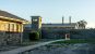 A yard, prison blocks, and guardtowers in Robben Island