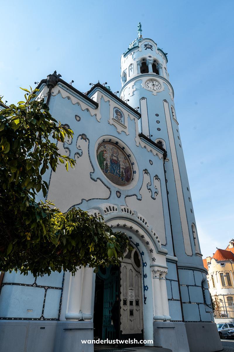 A sky blue and white art nouveau church
