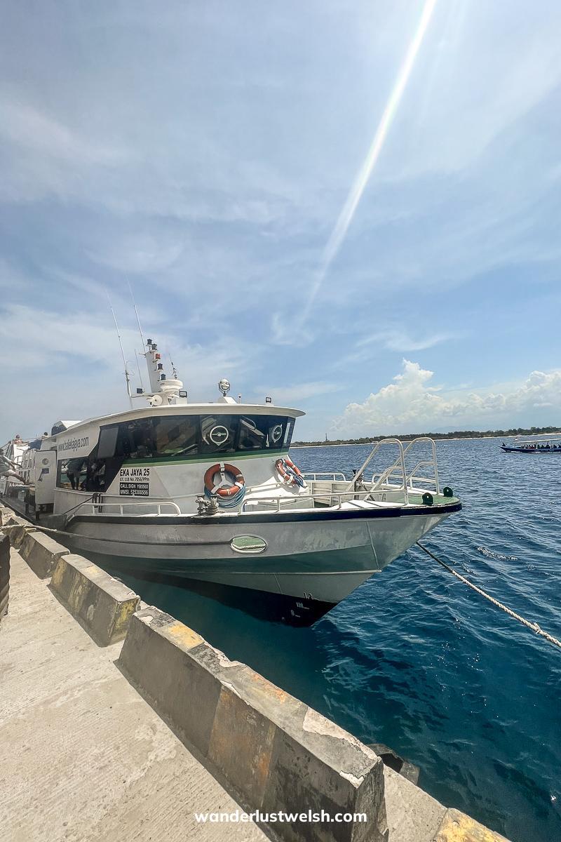 A speedboat docked at a concrete pier